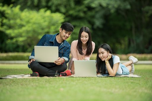 Kids laying in gras